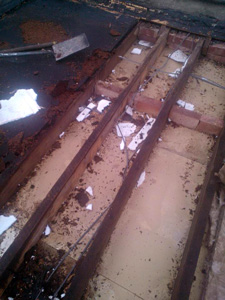 The  roof joists after stripping off the old roof boards